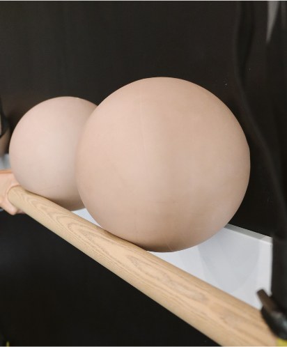 Exercise balls resting on the barre
